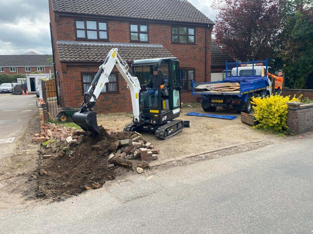 This is a photo of an operative of Faversham Driveways Digging out for a new tarmac driveway