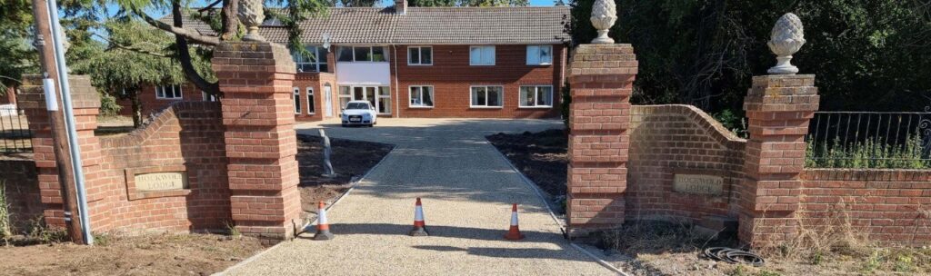 This is a photo of a newly installed chip and tar driveway, installed by Faversham Driveways